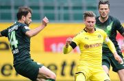 BVB-Verteidiger Lukasz Piszczek umringt von den Wolfsburgern Admir Mehmedi und Daniel Ginczek.